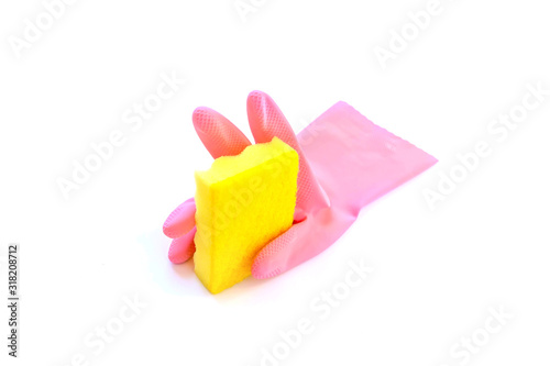 Pink rubber glove holding yellow domestic sponge isolated on a white background. Cleaning service concept.