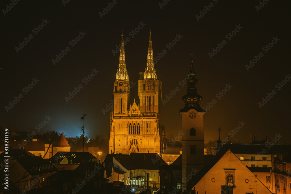 Fototapeta premium Zagreb Cathedral and St. Mary's Church in the night. Capital of Croatia, panoramic view