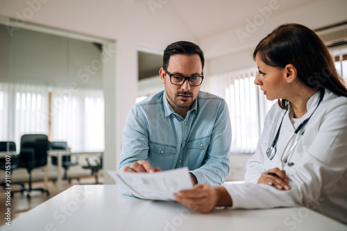 Discussing test results with doctor, portrait.