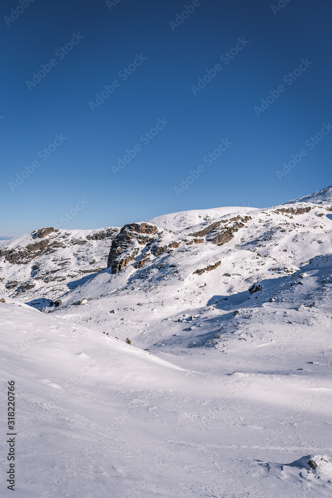 Beautiful alpine panoramic view snow capped mountains, European beautiful winter mountains.