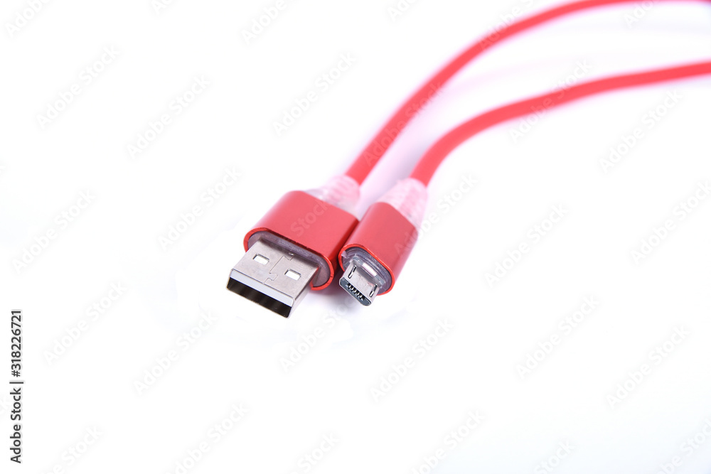 Red USB cable for smartphone charge isolated on white background. Red USB cable for smartphone charge isolated on white background.