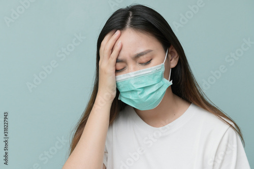 Asian women wearing surgical masks protect against the virus.Corona virus or covid 19 and wear a mask to prevent dust pm 2.5. © Varangkana