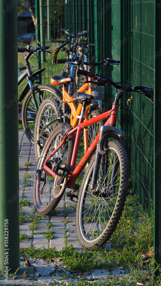 Parked bike near the Playground. Environmentally friendly mode of transport is parked at the Playground