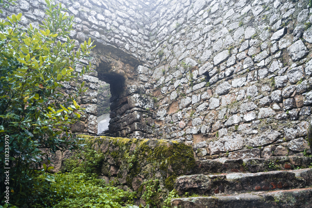 Small doorway and steps at the Moorish Castle (Castle of Moors) in Sintra Portugal on an overcast day in the winter