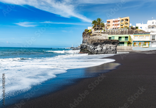 Black lava sand beach in Puerto Naos, La Palma, Canarian islands, Spain photo