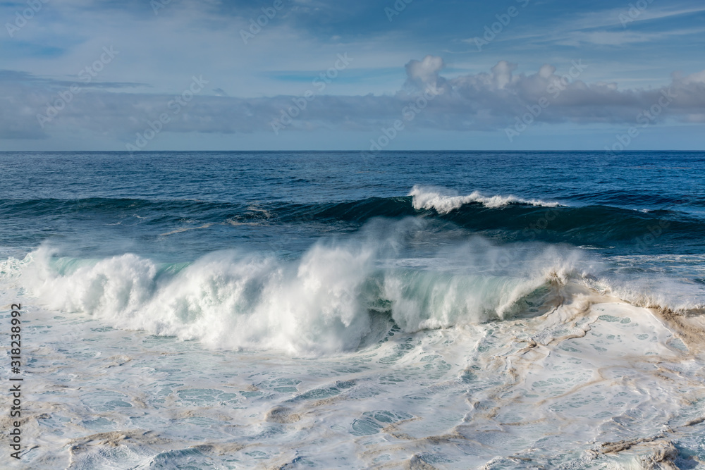 Dangerious ocean stormy waves hits black lava rocks by Faro de las Hoyas, La Palma island, Canary, Spain