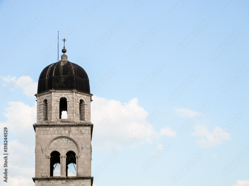 Bell tower of the Franciscan church in sunny day, Dubrovnik, Croatia