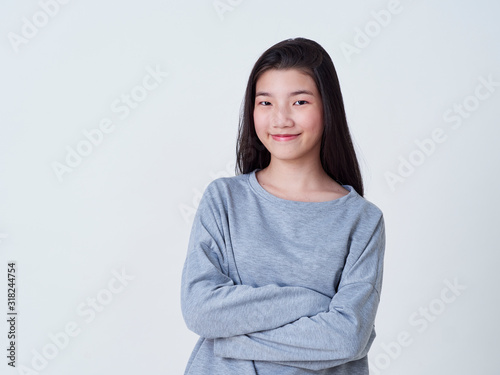 Smiling young woman over white background © jittima