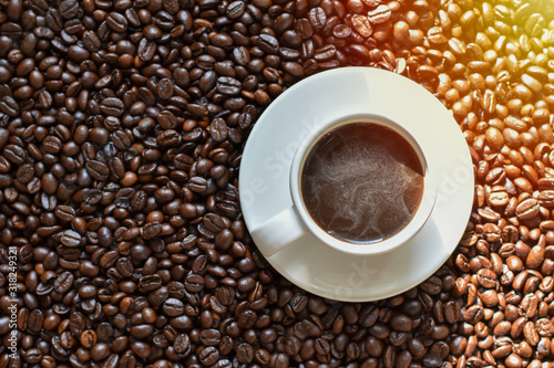 High angle view, White coffee cup on coffee beans.