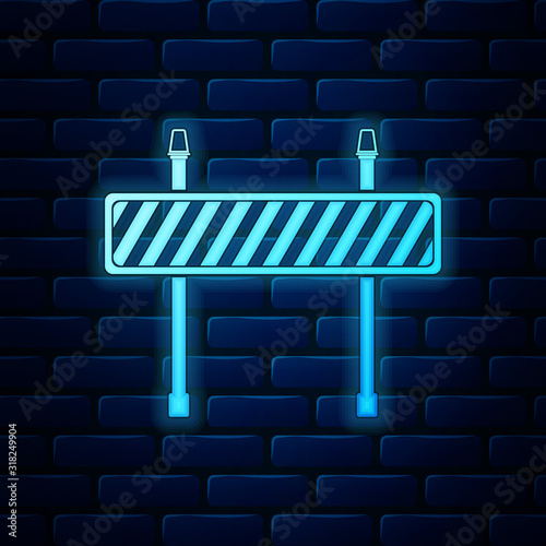 Glowing neon Road barrier icon isolated on brick wall background. Fence of building or repair works. Hurdle icon. Vector Illustration