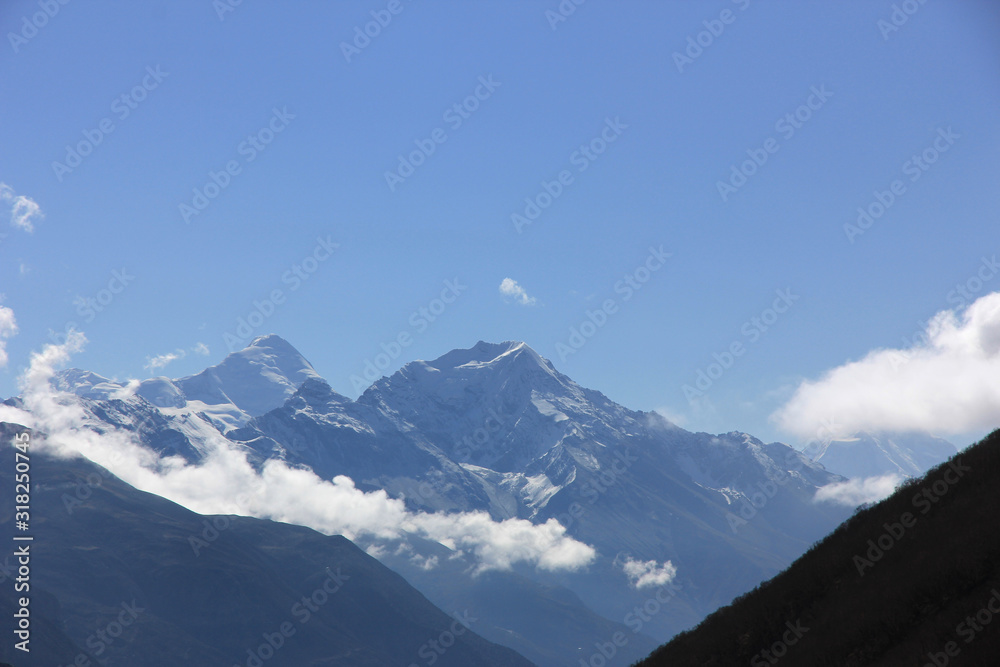 Snowy mountains against the blue sky. Mountains of Nepal