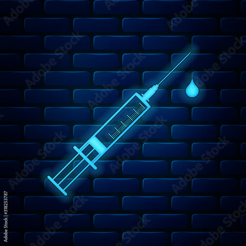 Glowing neon Medical syringe with needle and drop icon isolated on brick wall background. Syringe sign for vaccine, vaccination, injection, flu shot. Vector Illustration