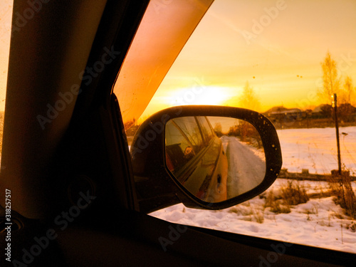 Car mirror at dawn in the winter. © schankz