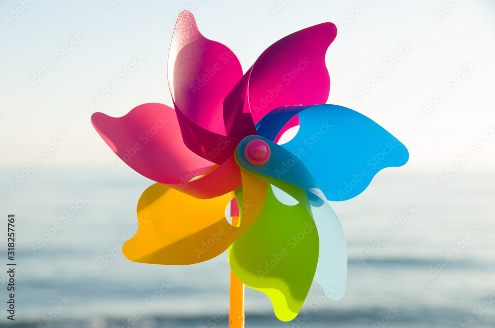 Colorful plastic toys. Windmill. Colorful background  - obrazy, fototapety, plakaty 