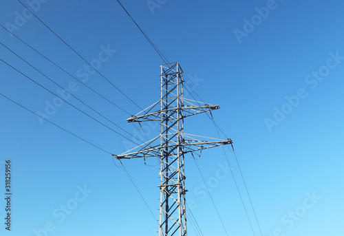 Electrical network of high voltage. Transportation of electricity through the high-voltage line. Metal tower with wires and cables. Clean country energy. Energy security. Work at height. Training matt