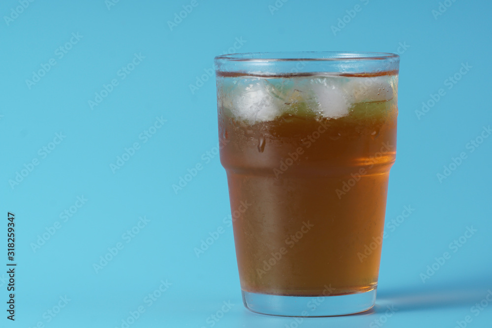 Ice tea over blue background