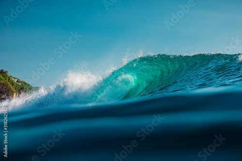 Fototapeta Naklejka Na Ścianę i Meble -  Barrel wave in sea. Blue wave with sun light