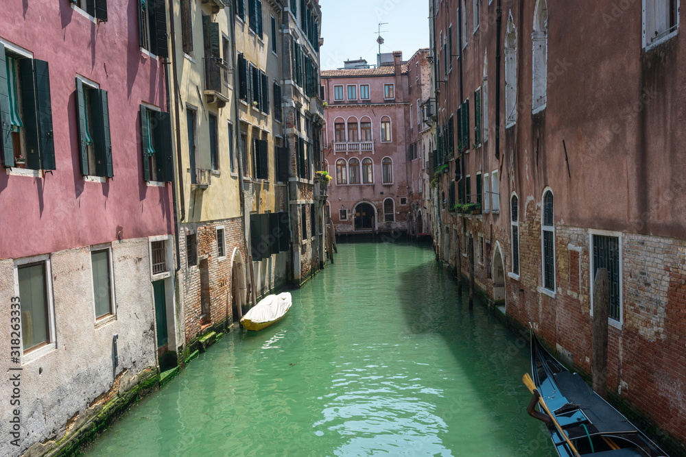 Venice. View of Venice Streets, canals, bridges, gondolas. Biennale. Colorful Old Authentic Buildings in Venice: doors, windows. Architecture of Ancient Italian city. Travel Tourism Concept. 