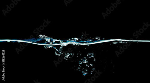 Dark water waves isolated on black background.