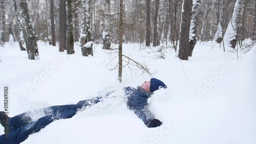 Wallpaper Mural a child fall in the snow in slowmotion. Snow storm. Sports outdoors. Active lifestyle. Torontodigital.ca