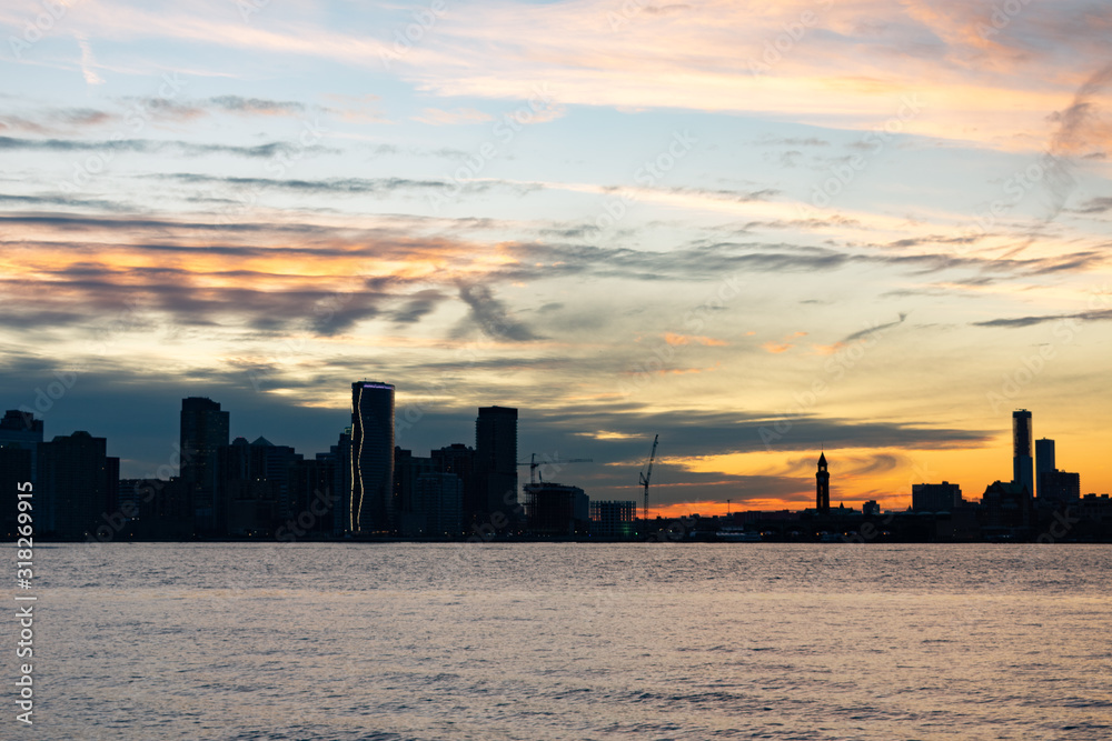 Silhouette of the Jersey City Skyline along the Hudson River during a Beautiful Sunset