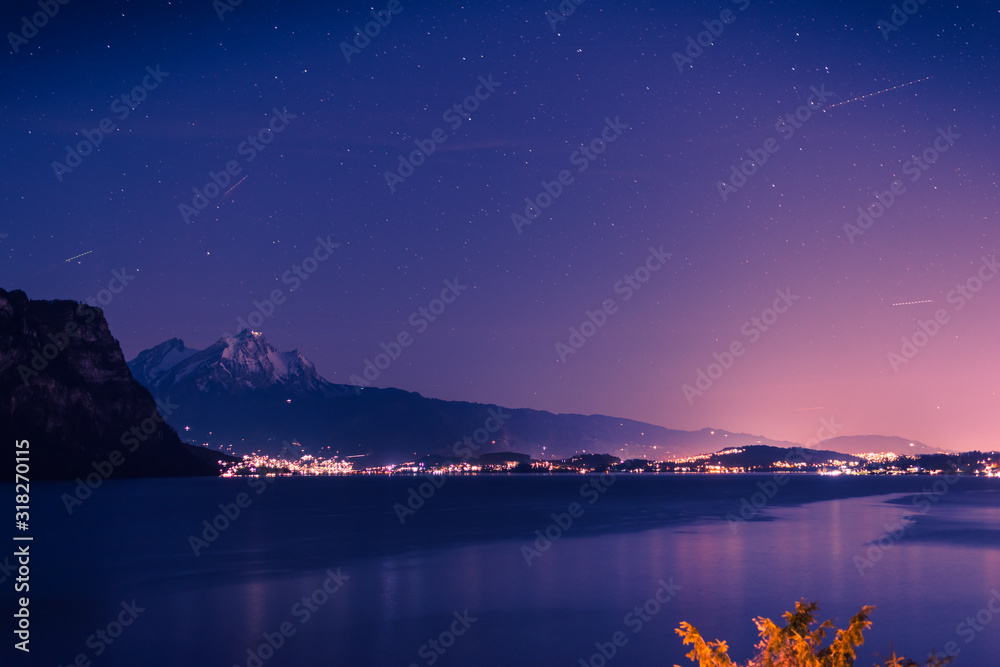 Blue night over Lake Lucerne and Pilatus Peak. Starry sky. Blue night over Lake Lucerne and Pilatus Peak. Starry sky.