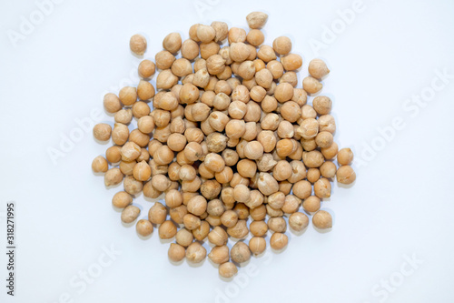 Chickpea lamb or turkish peas top view. Raw legume crop on a white background. Raw chickpea seeds for making hummus and falafel.