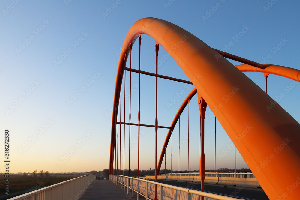 Rzeszow, Poland - 9 9 2018: Suspended road bridge across the autobahn. Metal construction technological structure. Modern architecture Rzeszow, Poland - 9 9 2018: Suspended road bridge across the autobahn. Metal construction technological structure. Modern architecture