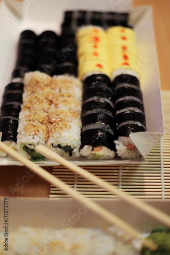 background on the theme of sushi.  different types of sushi on the table