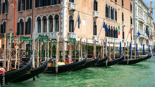 Venice, Italy. View of Venice from the Grand Canal. Venetian Gondolas. Old colorful buildings in Venice. Jetty. Boat trip through the canals of Venice. Vacation in Europe concept. Italian Landmarks. © GenоМ.