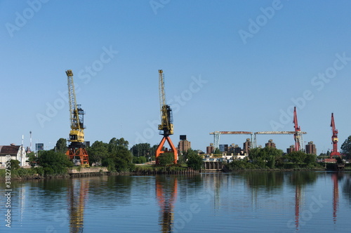 Idle dock cranes by the river