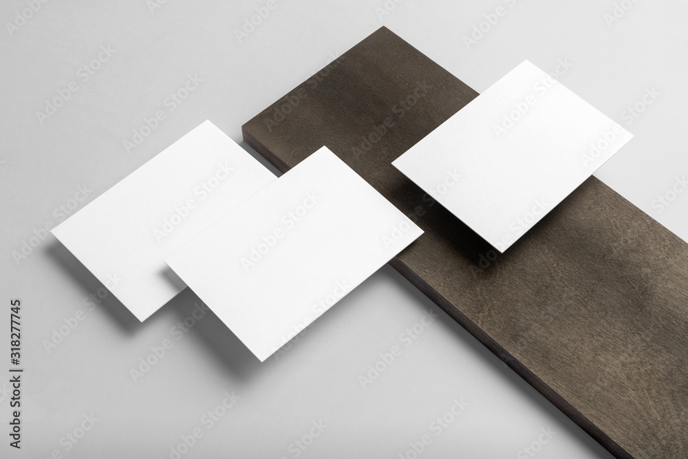 Real photo, stationery branding mockup template, isolated on light grey background with wooden elements to place your design. Real photo, stationery branding mockup template, isolated on light grey background with wooden elements to place your design.