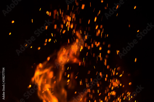 fire on a black background orange flame night fire