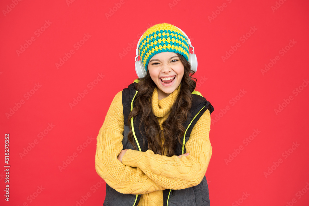 Winter music chart. Winter playlist. Entertain herself by being creative. Recording studio. Beautiful voice. Developing voice. Small girl listen music headphones. Hobby concept. Winter holidays