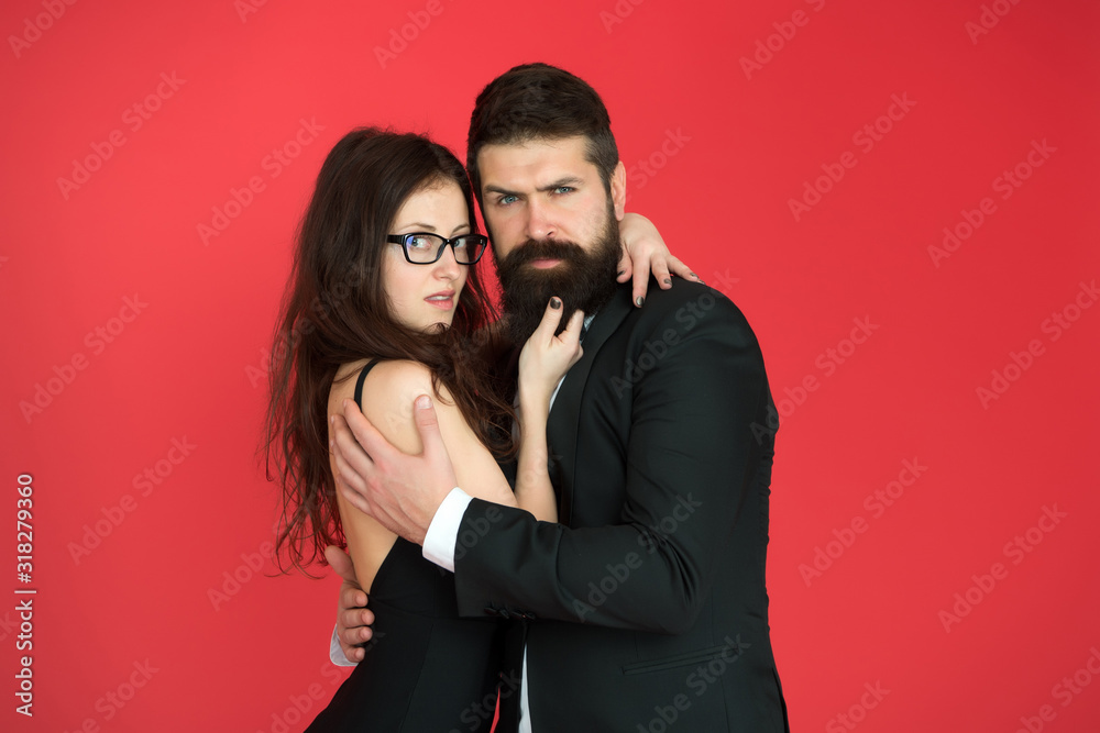 We are different but we love each other. Couple in love red background. Bearded man hug sexy woman. Love date and dating. Love and romance. Romantic relationship. Valentines day