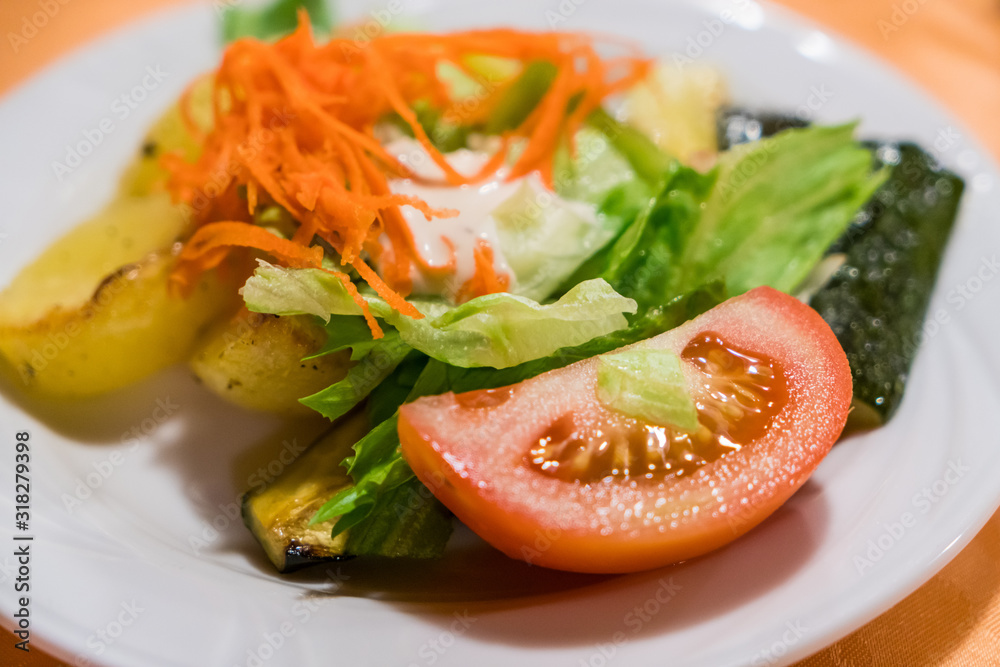 Fresh classic caesar salad on dining table Fresh classic caesar salad on dining table