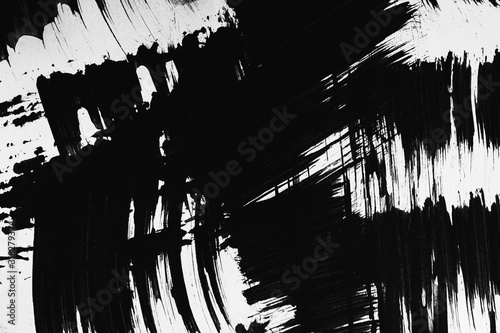 Patterns of black paint from a brush on a white background