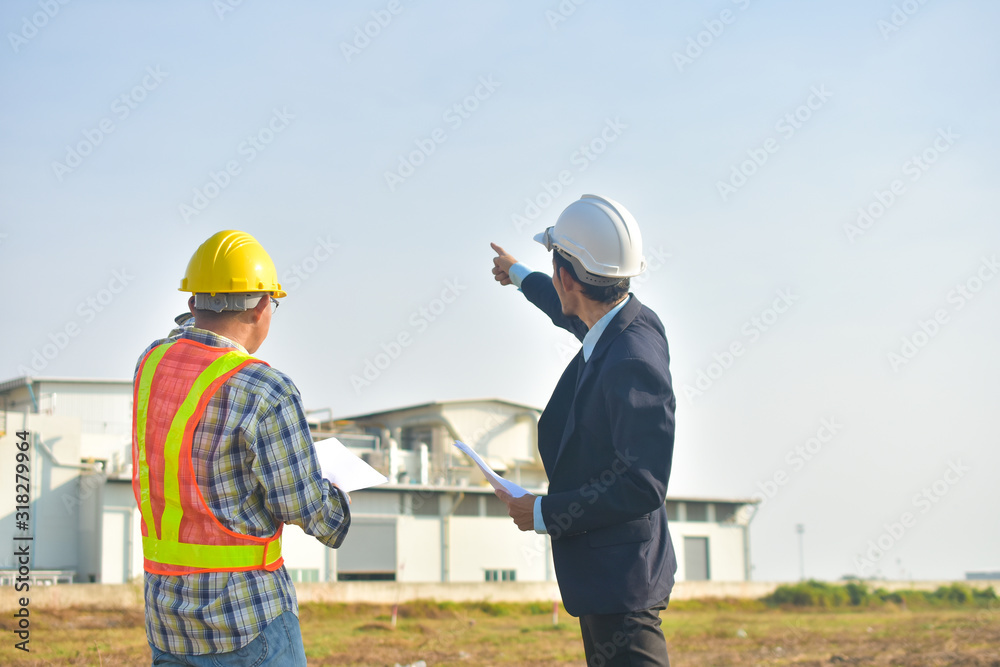 Project Manager taking with Engineer construction plan project building factory construction Project Manager taking with Engineer construction plan project building factory construction