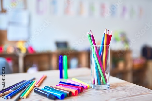 Desk with lots of colored pencils and pen to draw at kindergarten