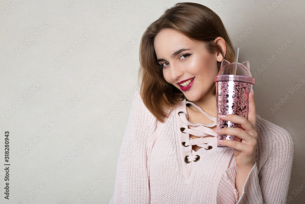 Cheerful girl holding glass of juice Cheerful girl holding glass of juice