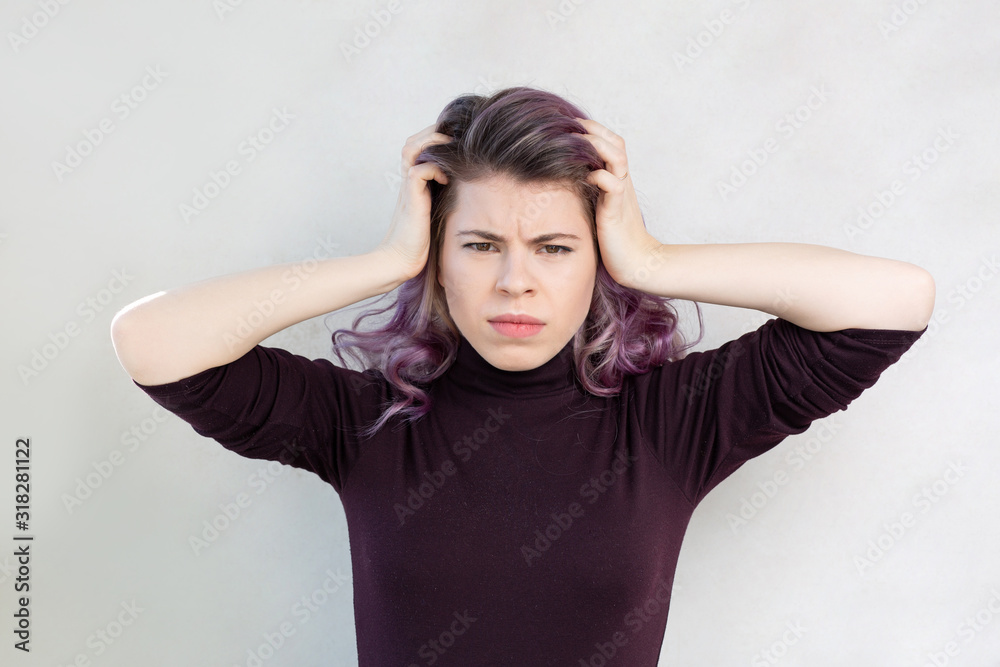 Depressed girl holding her head Depressed girl holding her head