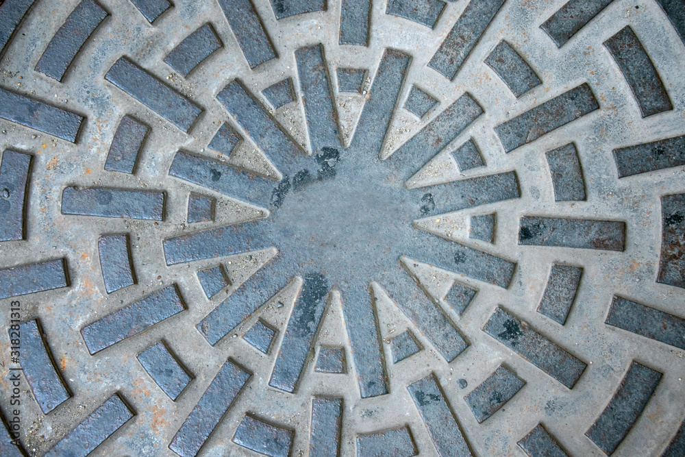 Closeup of manhole cover or pipe cap on the footpath,abstract wallpaper. Closeup of manhole cover or pipe cap on the footpath,abstract wallpaper.