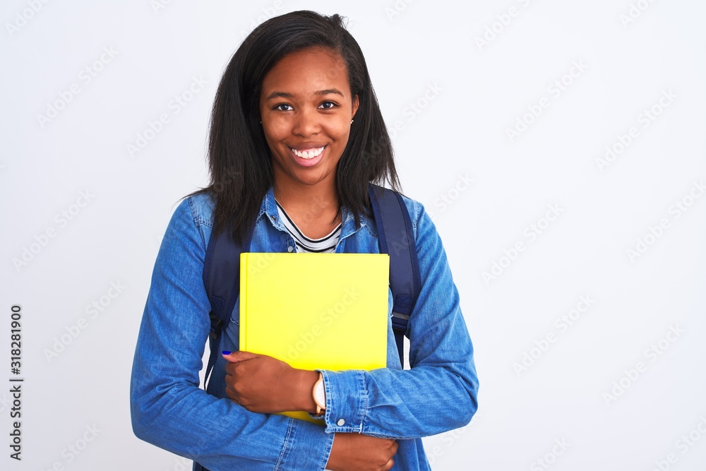 Young african american student woman wearing backpack and book over isolated background with a happy face standing and smiling with a confident smile showing teeth Young african american student woman wearing backpack and book over isolated background with a happy face standing and smiling with a confident smile showing teeth
