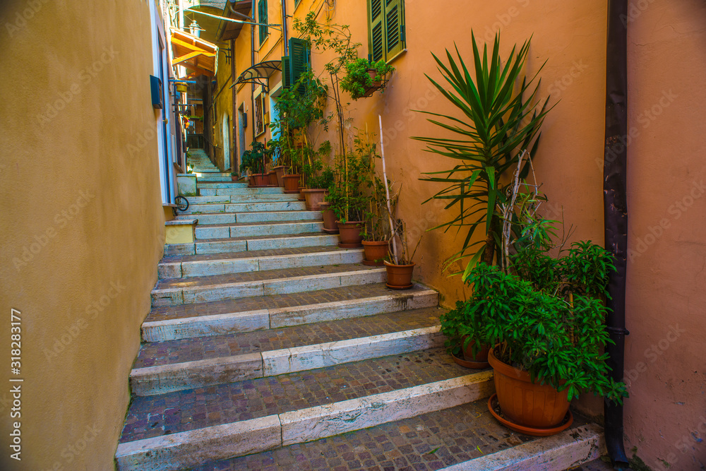 Fototapeta premium Beautiful Italian street of a small old provincial town