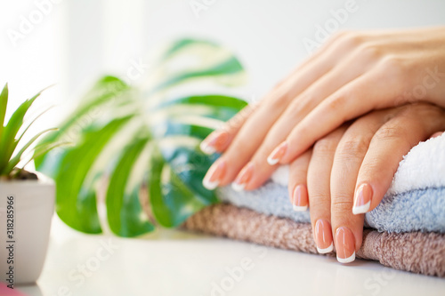 Nails care. Beautiful woman s nails with french manicure  in beauty studio