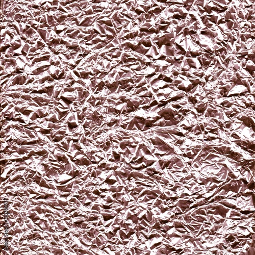 Crumpled foil surface. Rose gold.