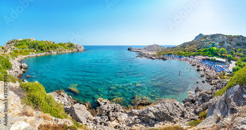 Fototapeta Naklejka Na Ścianę i Meble -  Ladiko bay with Ladiko beach with sun beds and sun shades (Rhodes, Greece)