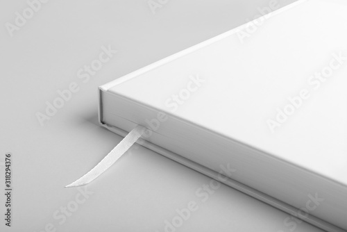 Real photo, blank book, brochure, booklet mockup template, hard cover, isolated on light grey background to place your design. 