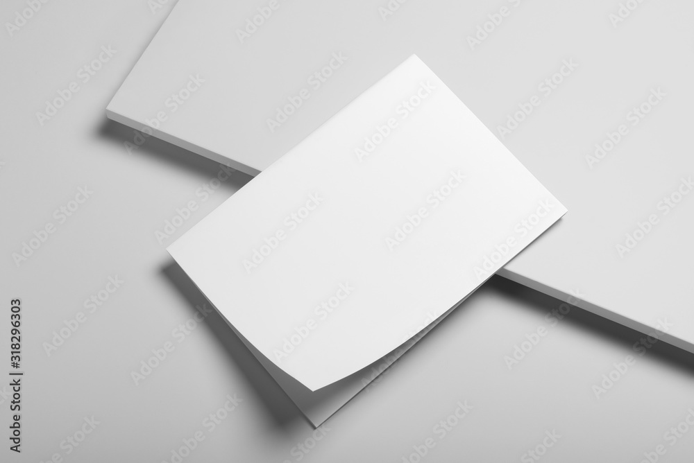 Real photo blank portrait A4, US-Letter, brochure magazine mockup isolated on gray background. Real photo blank portrait A4, US-Letter, brochure magazine mockup isolated on gray background.