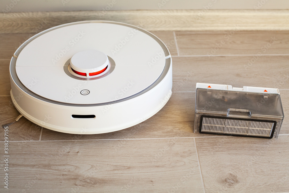 Robot vacuum cleaner performs automatic cleaning of the apartment at a certain time. Smart home Robot vacuum cleaner performs automatic cleaning of the apartment at a certain time. Smart home